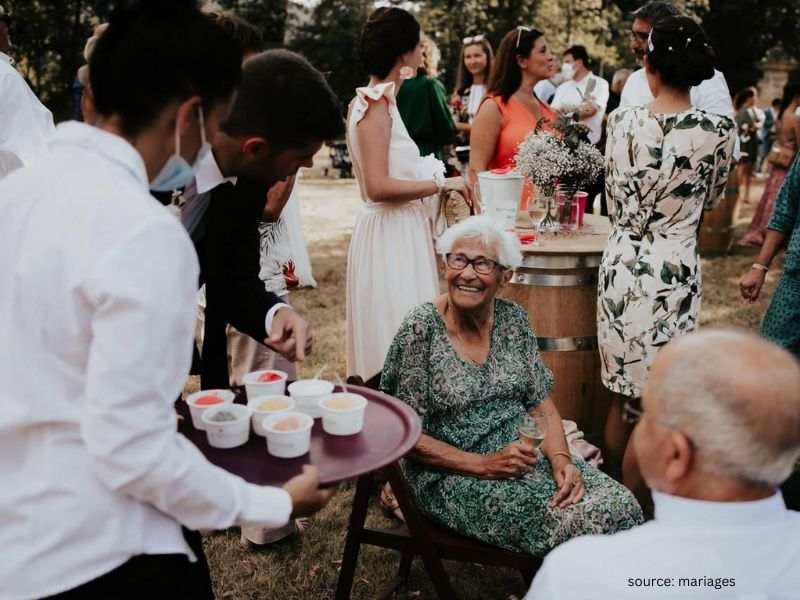 Outdoor wedding seating with shaded accessible area designed for elderly guest comfort.