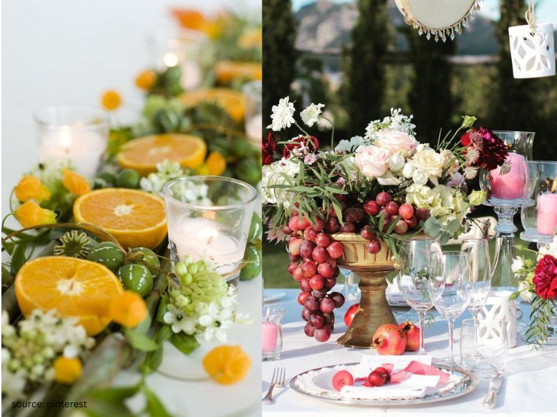 Wedding table centerpiece styled with lemons, candles, and greenery for elegant affordable decor.
