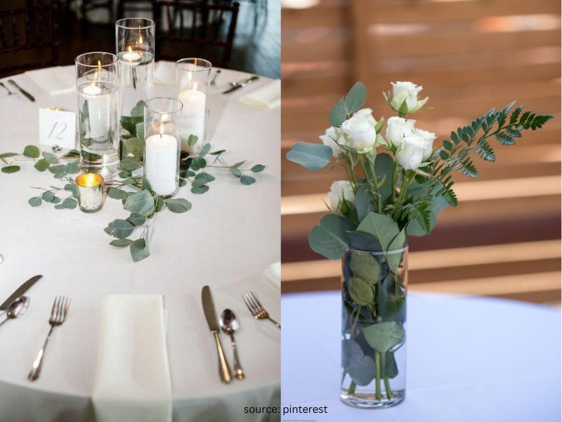 Simple wedding centerpiece with greenery, candles, and minimal flowers for elegant budget wedding decor.