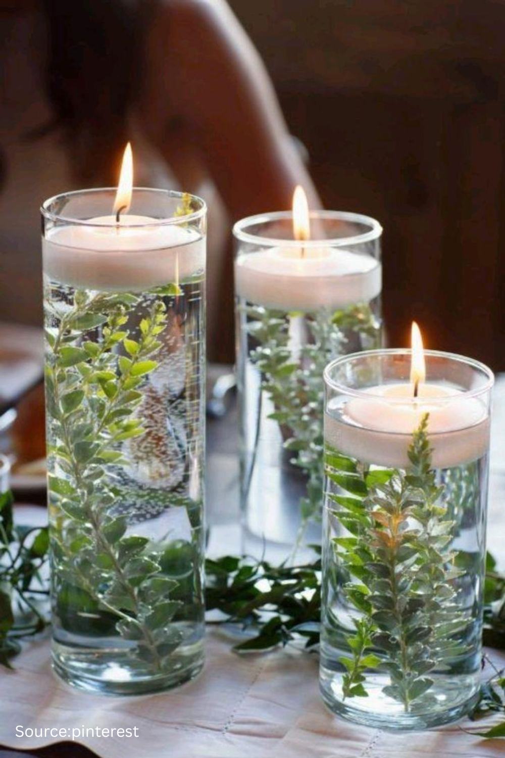 Floating candles and petals in water