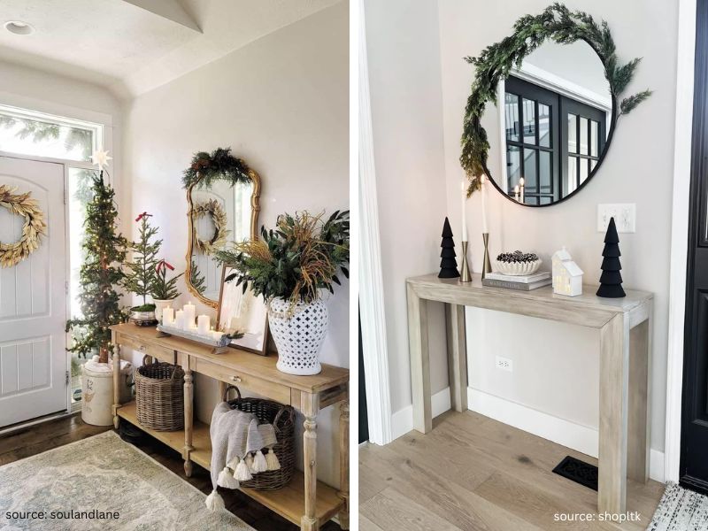 Christmas entryway console table decorated with greenery, candles, books, and a small tree